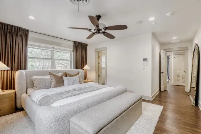 Spacious bedroom retreat with clean lines and a calming palette, offering a peaceful escape at the end of the day