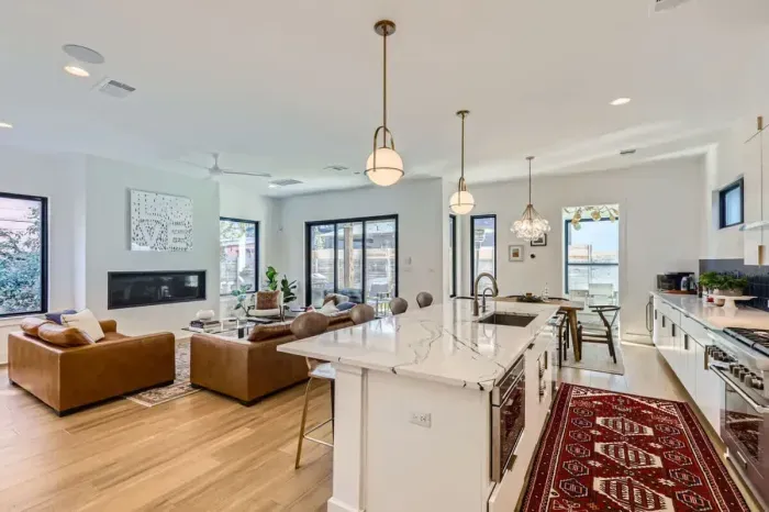 Spacious kitchen with a large island and seating, ideal for enjoying morning coffee or group meal prep.