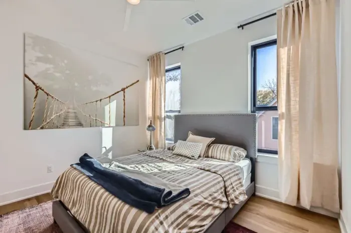 Peaceful bedroom with a plush queen-sized bed and soft linens for a restful night’s sleep.