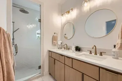 Modern bathroom with sleek fixtures, a spacious shower, and high-end amenities.