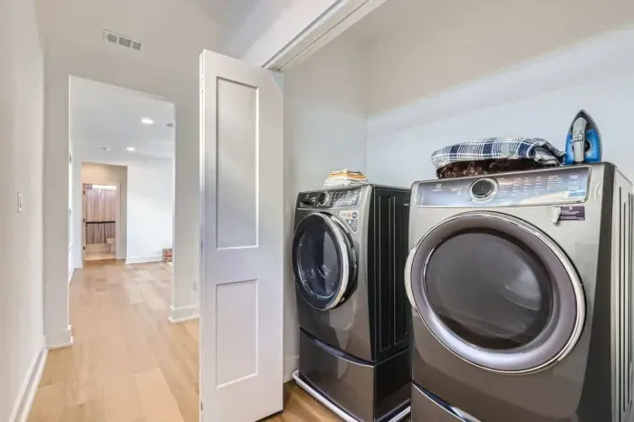Efficient laundry space with modern appliances and a practical layout for completing laundry tasks with ease.