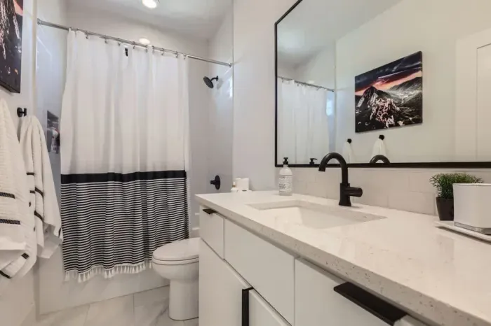 Clean and crisp bathroom with contemporary finishes and an inviting atmosphere.