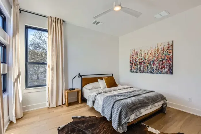 Cozy and inviting bedroom featuring a comfortable mattress and stylish decor.