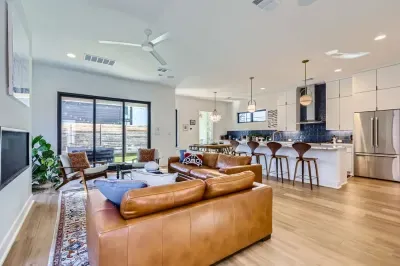 Sophisticated living room with mid-century modern furniture and bold artwork.
