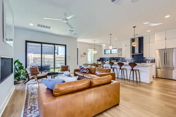 Sophisticated living room with mid-century modern furniture and bold artwork.