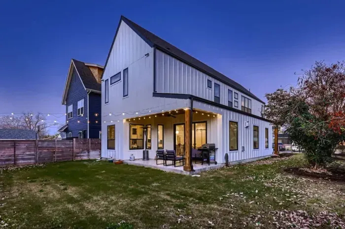 Spacious backyard with a patio, perfect for outdoor dining or relaxing in the sun.