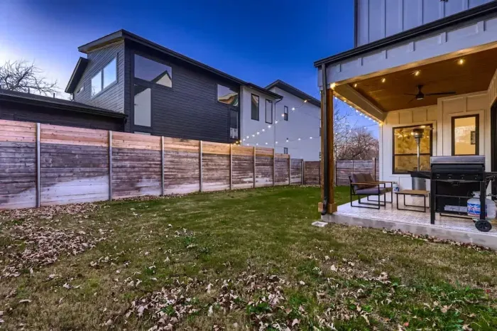 Serene backyard with a patio, ideal for dining al fresco or unwinding under the stars.