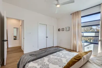 Guest-friendly bedroom with a cozy vibe and ample storage space.