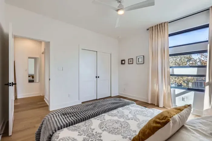 Guest-friendly bedroom with a cozy vibe and ample storage space.