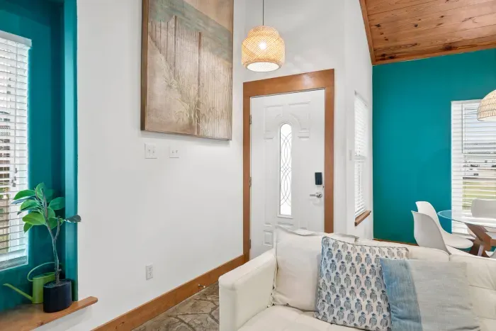 Bright and welcoming living room with stylish décor and natural seaside light.