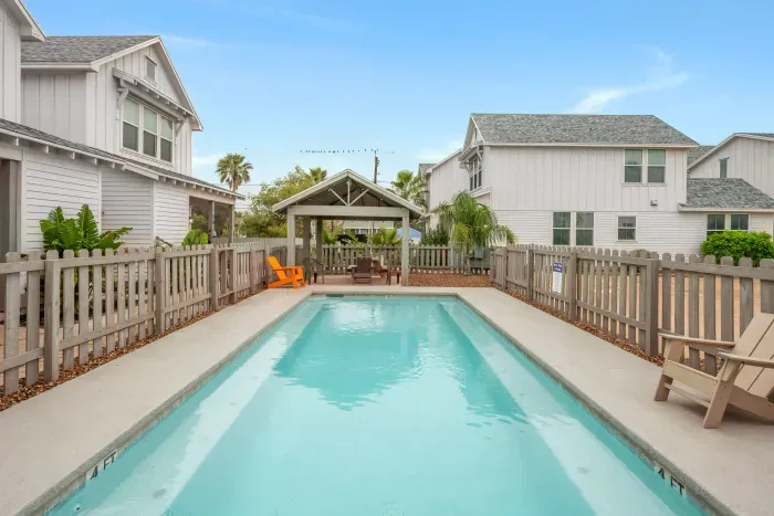 A private community pool sparkling pool perfect for relaxing after a day at the beach.