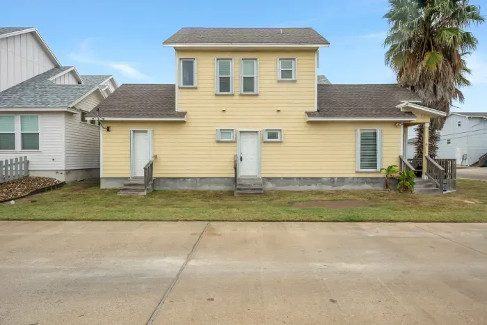 Inviting coastal exterior with charming architecture and sunny beach-town appeal.