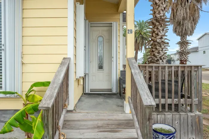 Welcoming front walkway with classic Port Aransas beach cottage style.