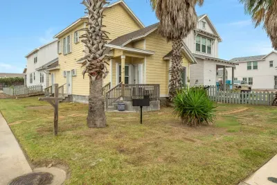 Charming coastal home with tropical landscaping and beach-town appeal.