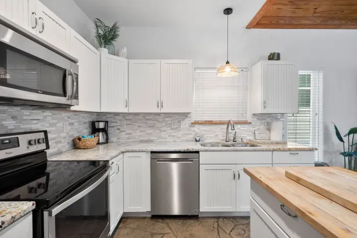Fully stocked modern kitchen with stainless appliances and everything you need.