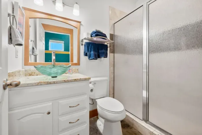 Clean and refreshing bathroom with a roomy walk-in shower.