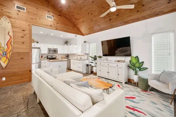 Cozy and stylish lounge space with a coastal vibe and natural light.