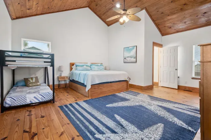 Spacious bunk room with two beds ideal for kids and groups.