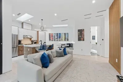 Open-concept living room with seamless flow to the kitchen and dining areas.