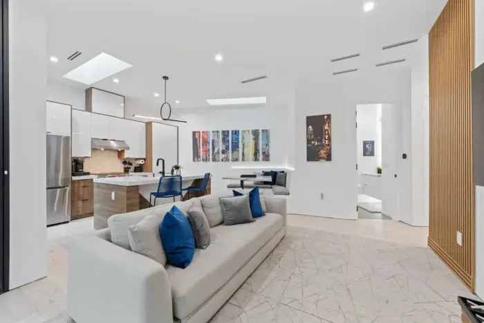 Open-concept living room with seamless flow to the kitchen and dining areas.