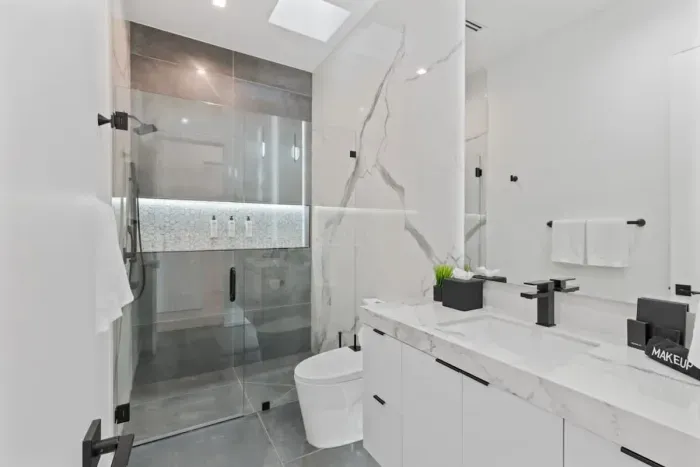 Unwind in our spacious bathroom with modern amenities and a touch of luxury.