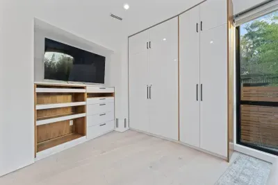 Modern bedroom with minimalist design and high-quality bedding.