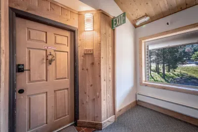 Bright entry hallway with natural light and wood accents.