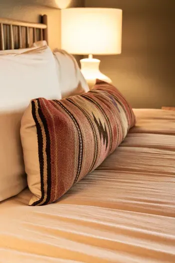 Elegant bedroom with luxurious linens and a calming color palette.