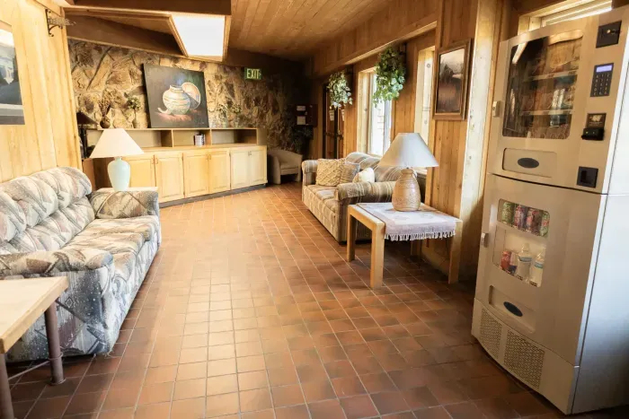 Bright entry hallway with natural light and wood accents.