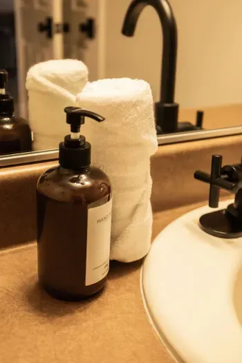 Bright primary bathroom with fresh towels and modern essentials.