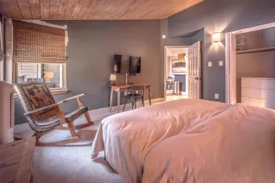 Spacious bedroom with soft bedding and relaxing decor.