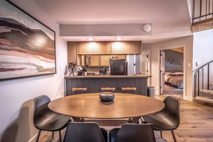 Contemporary dining room with warm lighting.