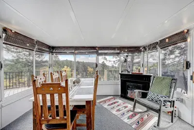 Sunroom patio with year-round mountain views.