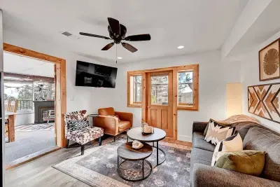 Cozy living room with mountain view and smart TV.