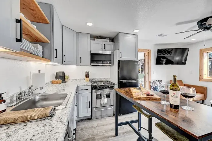 Bright modern kitchen with full appliances.