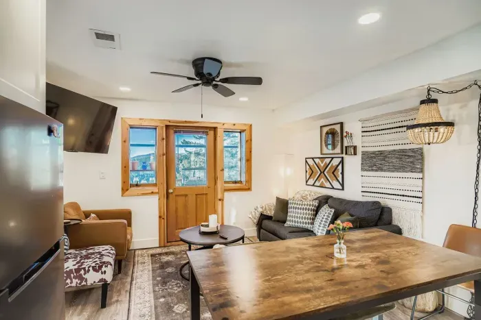 Living room with smart TV and mountain cabin ambiance.