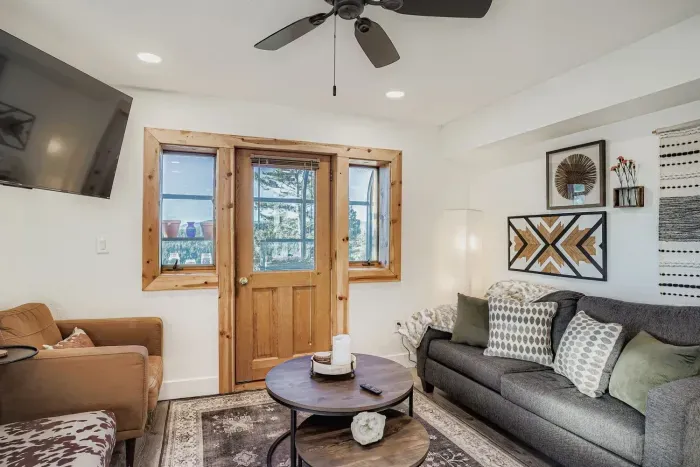 Inviting living room with mountain-inspired décor and natural light.