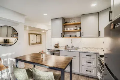 Dining area with custom wood table and cozy lighting.
