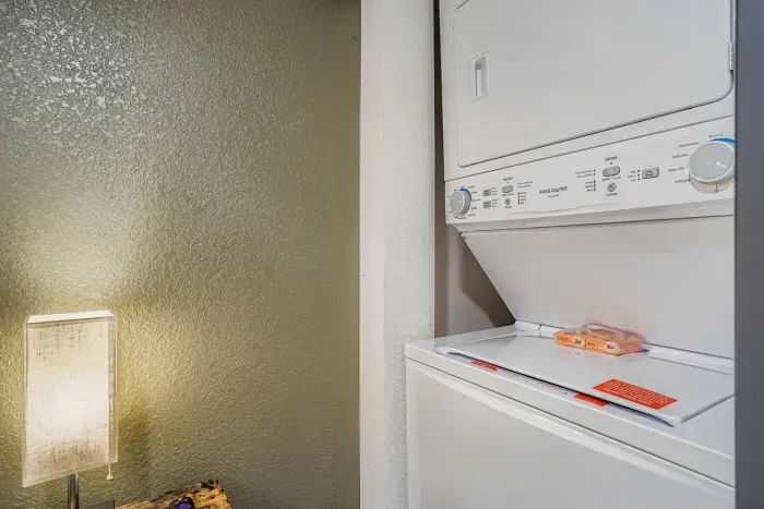 Laundry area with washer and dryer for guest convenience.
