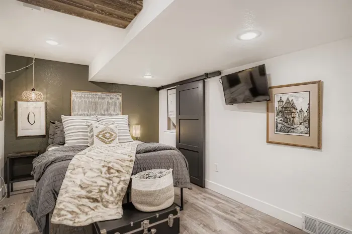 Primary bedroom featuring a plush king bed and cozy mountain charm.