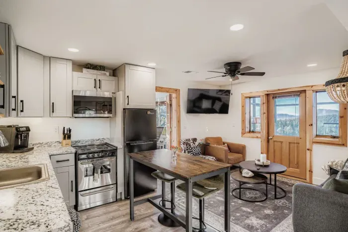 Fully equipped kitchen with updated appliances and breakfast bar.