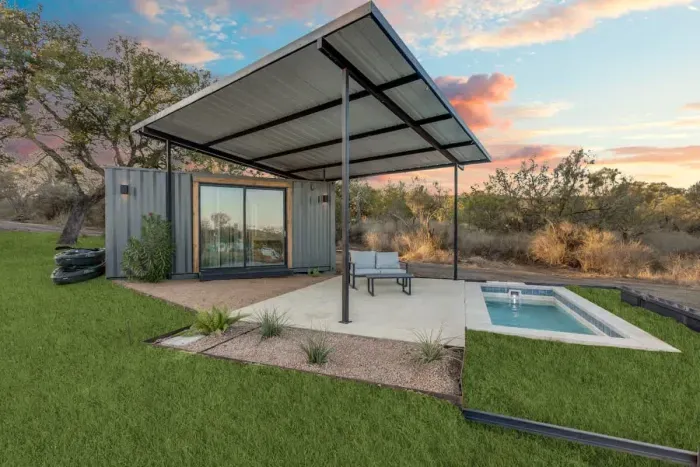 Modern container complete with a private pool and outdoor furniture.  Lake views, and plenty of parking