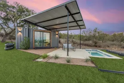 Modern container complete with a private pool and outdoor furniture.  Lake views, and plenty of parking