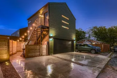 Exterior with own parking space and private entry up the stairs.