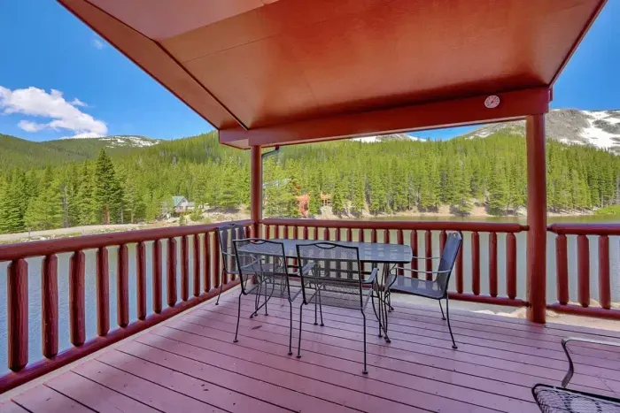 Alfresco dining space on the balcony with stunning views of lush greenery. Enjoy meals surrounded by nature in this serene and inviting setting. Perfect for intimate gatherings or peaceful moments.