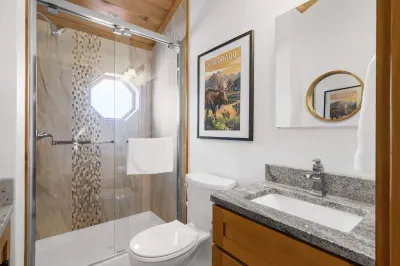 Elegant bathroom featuring a luxurious marble countertop. The sleek design combines style and functionality, creating a sophisticated space for relaxation. With its timeless appeal, the marble top adds a touch of luxury, making this bathroom both bea