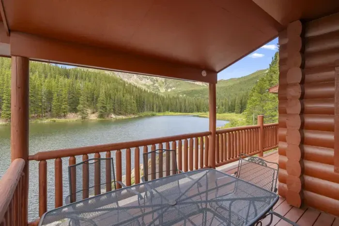 Outdoor dining space on the balcony, offering a peaceful retreat with views of vibrant greenery. Ideal for dining under the open sky, this serene setting is perfect for morning coffee or evening meals. Embrace the beauty of nature while enjoying a re