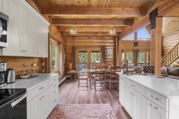 Spacious kitchen with a large island and seating, ideal for enjoying morning coffee or group meal prep.