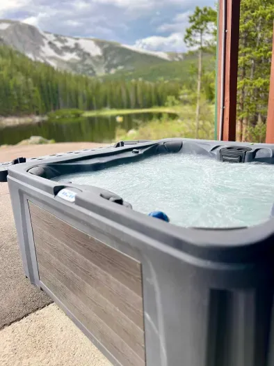 Enjoy mountain views from the luxurious hot tub!