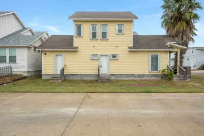 Inviting coastal exterior with charming architecture and sunny beach-town appeal.